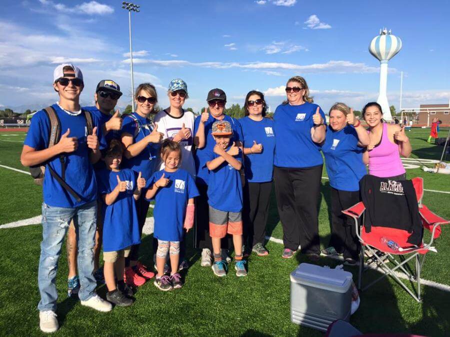 people giving a thumbs up at relay for life