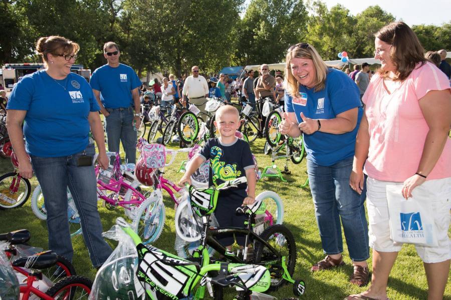 child winning bicycle