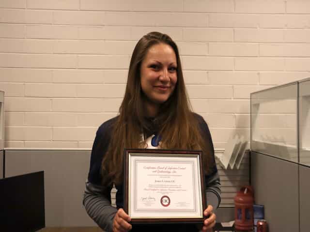Jessica Garcia with her certificate in infection control