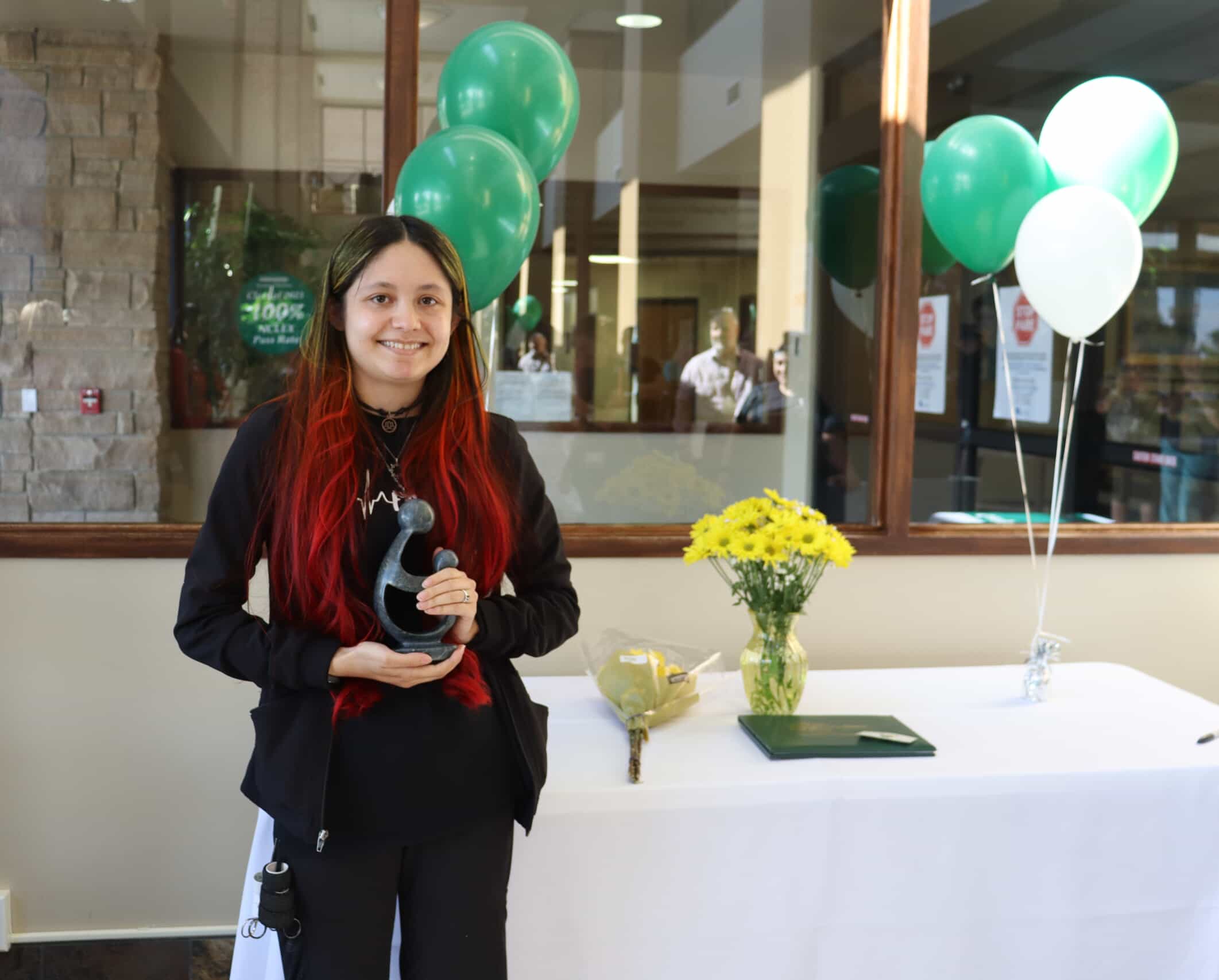 Lilliana holds her award. 
