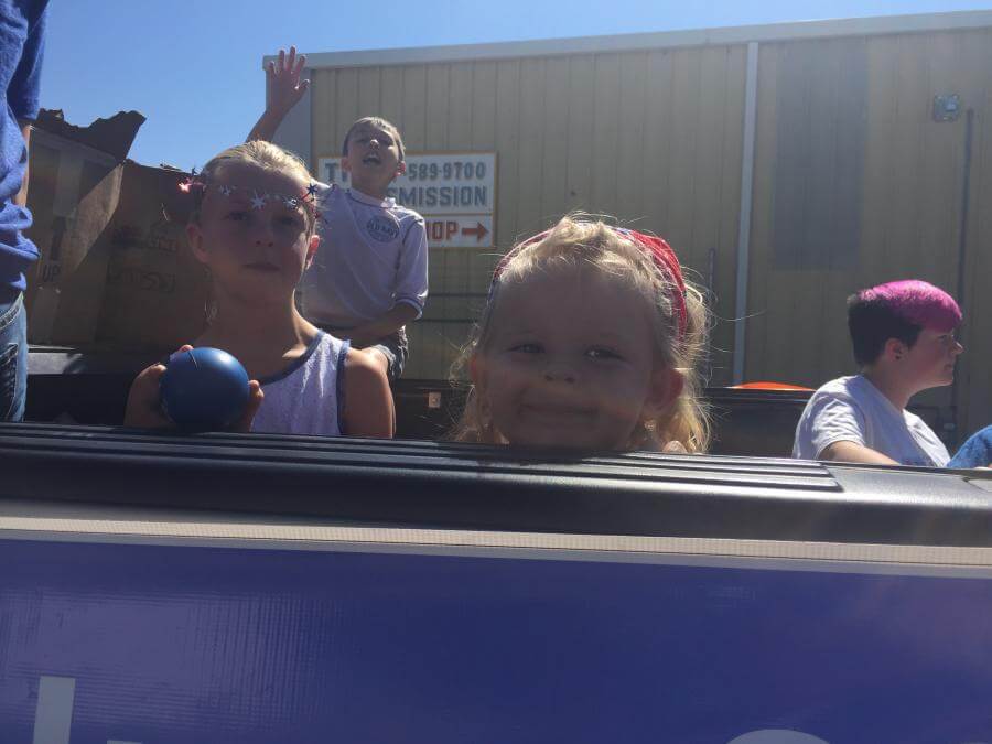 children in parade truck