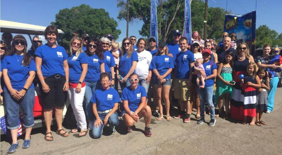 team posing after the parade