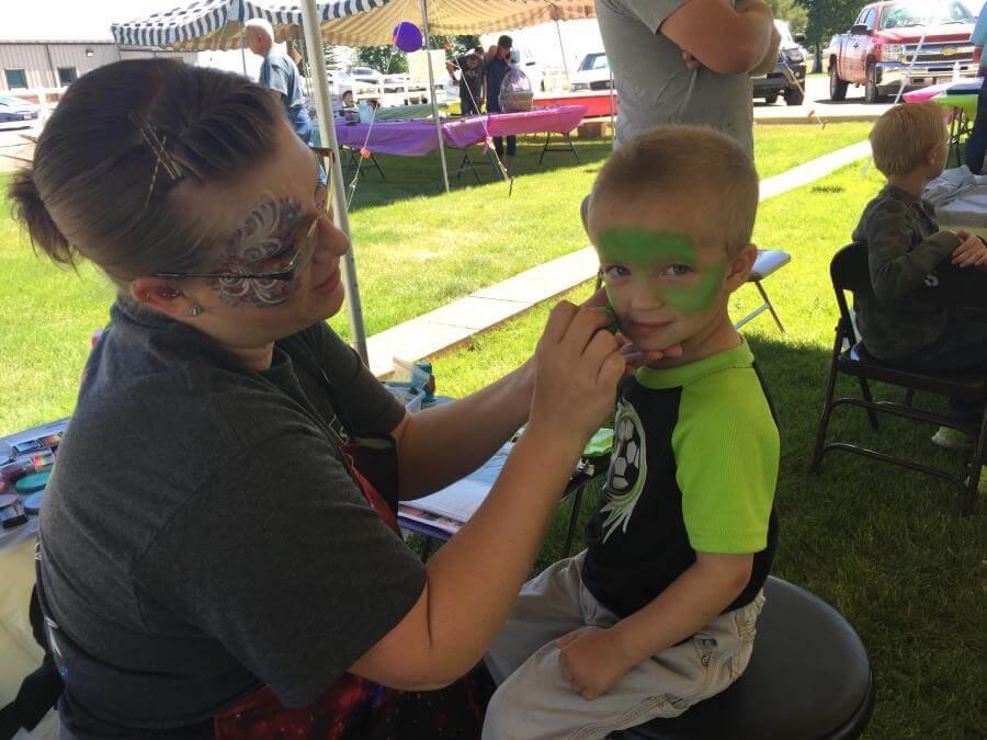 child getting face painted