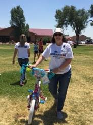 Woman walking a bike