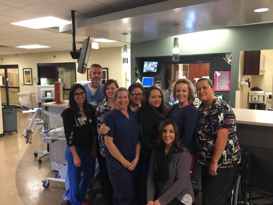 Julie Ramstetter, Center, RN, Trauma Coordinator, surrounded by some of the ED staff.