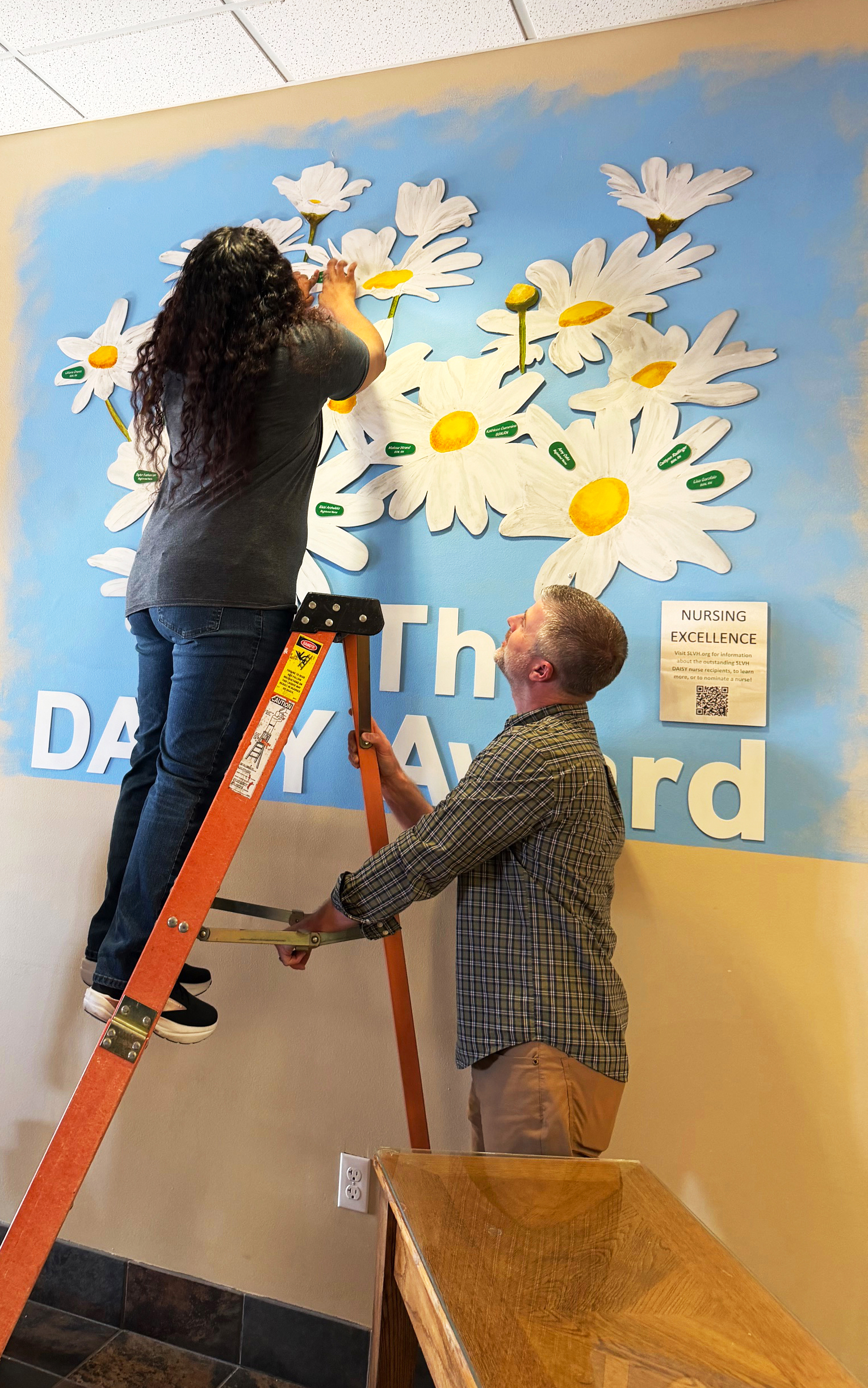 Shaalynn holding DAISY Banner