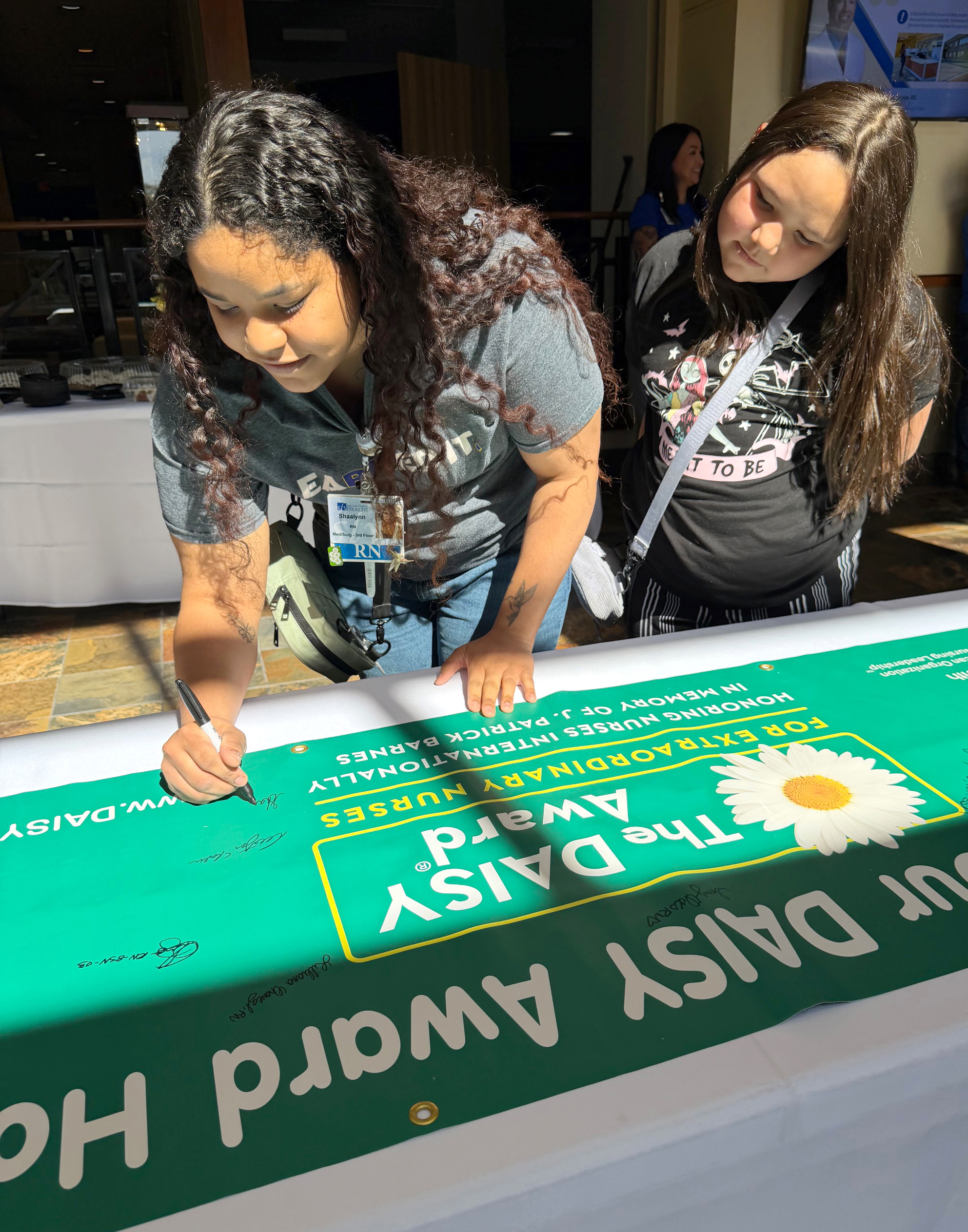 Shaalynn signing DAISY Banner