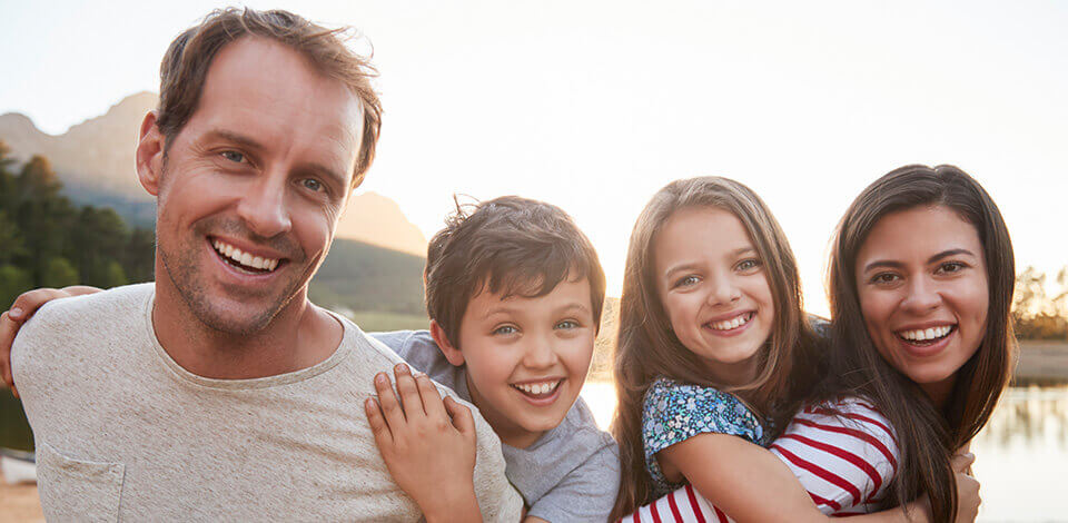 Picture of family smiling at camera