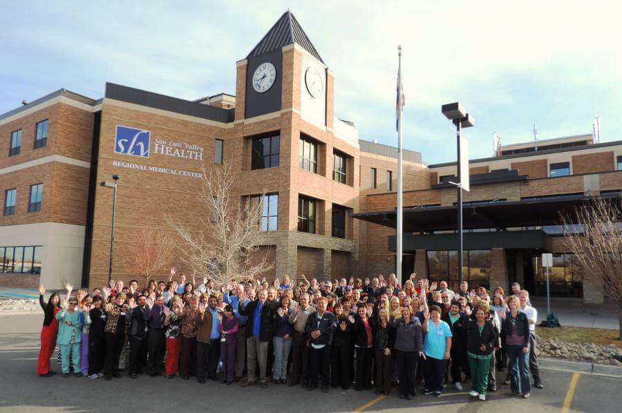 SLV staff outside regional medical building waving