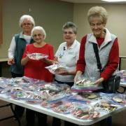 Group of volunteers wrapping up meals